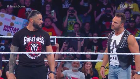 LA confronts Roman in the ring